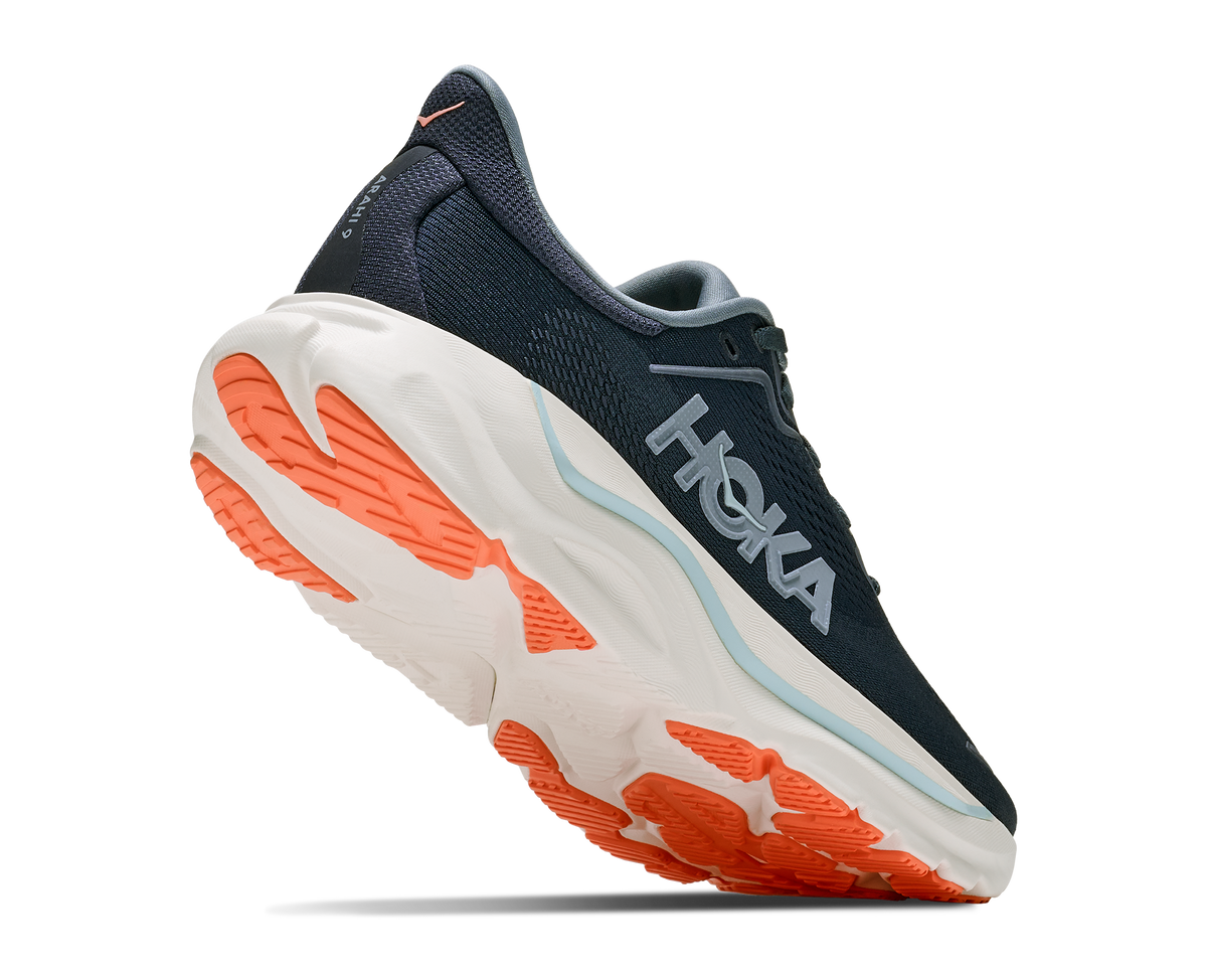 Navy and orange running shoe with 'Hoka' branding on a white background