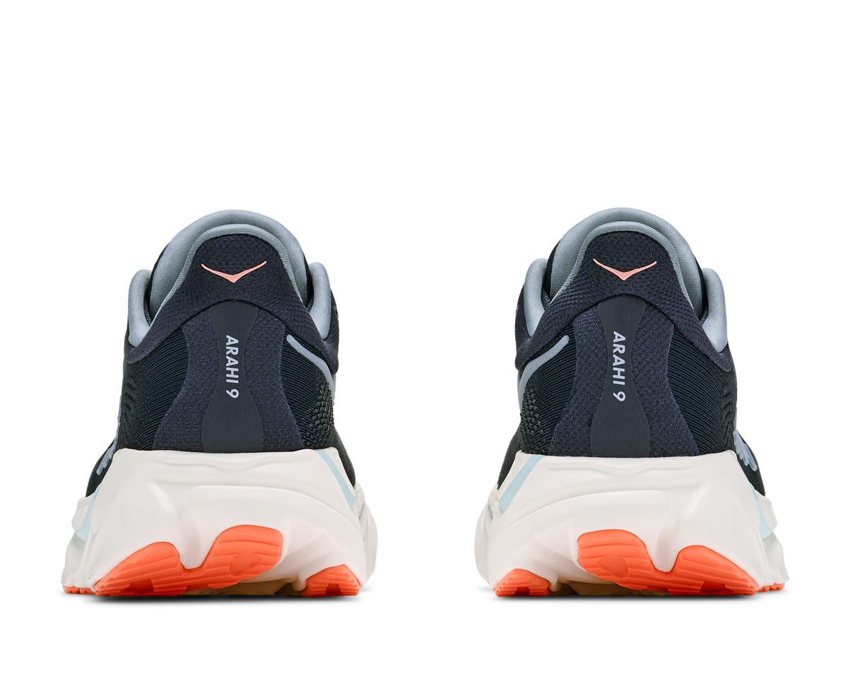 Pair of black and orange sneakers with 'Arahi' branding on a white background