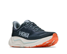 Navy running shoe with orange sole on a white background