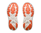 Close-up of a pair of white and orange shoe soles on a white background