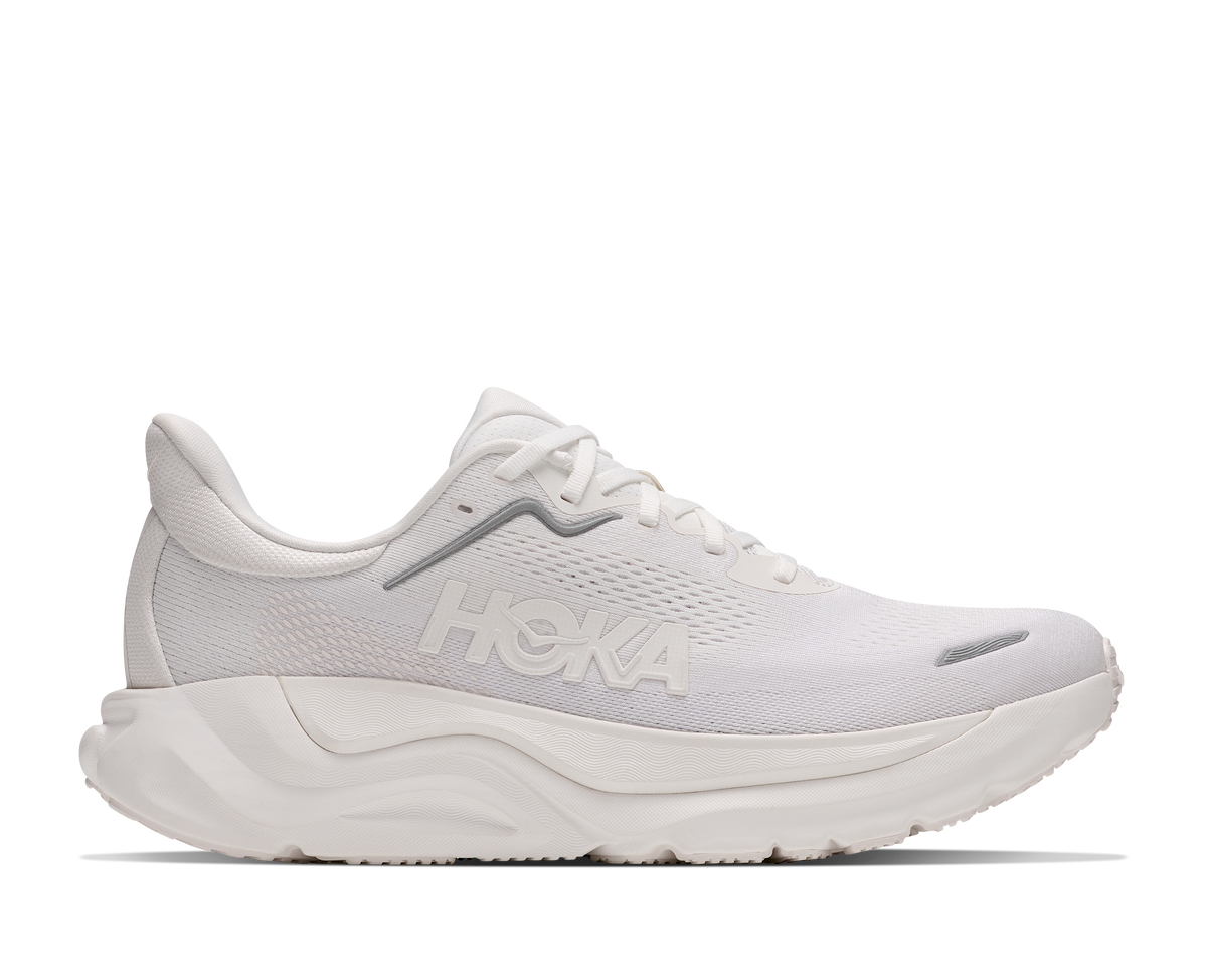 A white HOKA running shoe shown from the side against a plain white background.