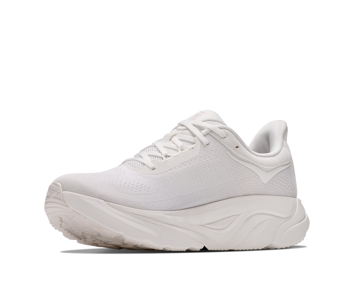 A white athletic sneaker shown from a side profile view against a clean white background.