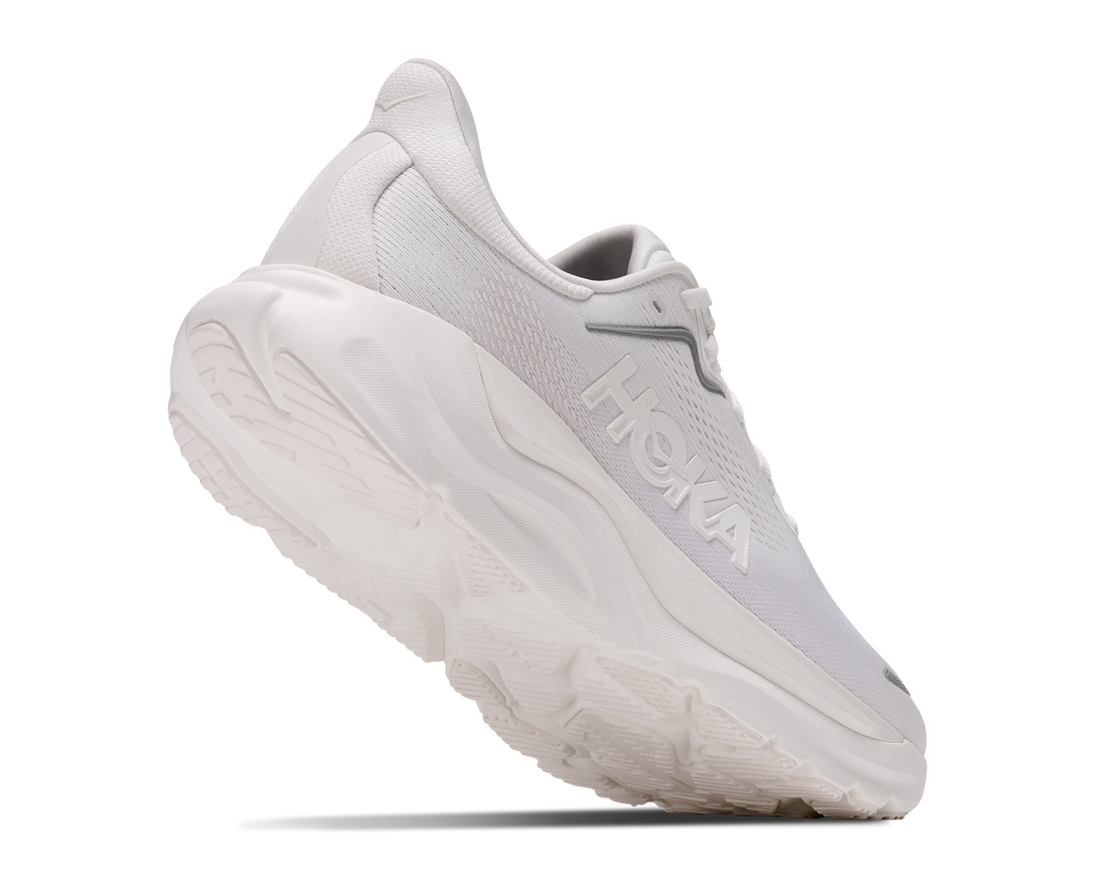 A white HOKA running shoe shown at a three-quarter angle against a solid white background.