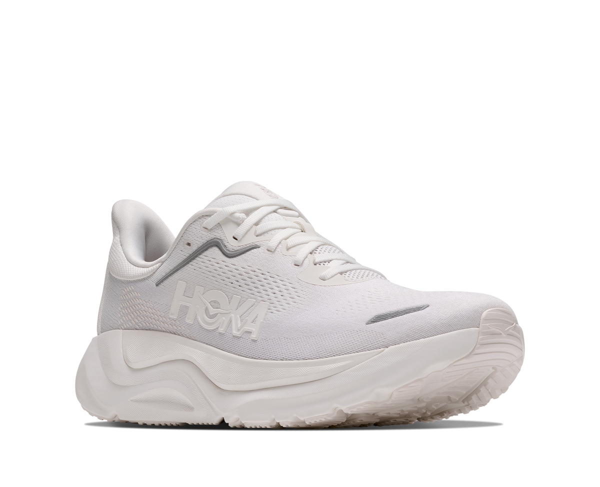 A white Hoka running shoe shown from a side profile view against a solid white background.