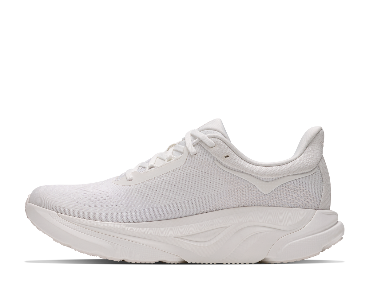 A white athletic sneaker shown from the side profile against a clean white background.