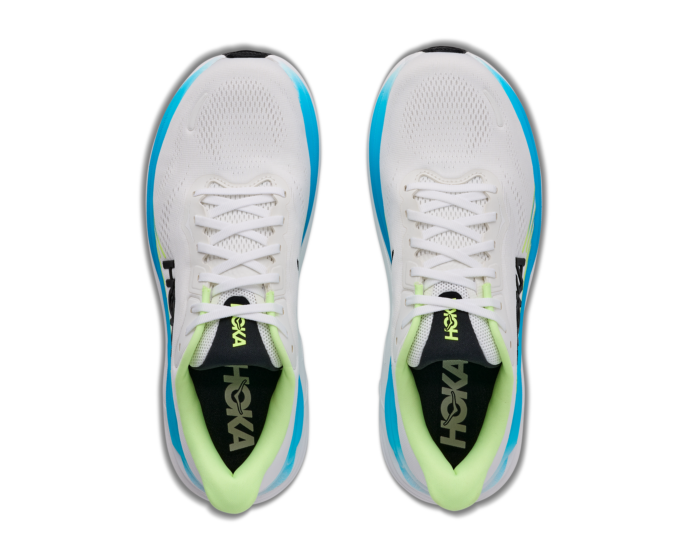 White running shoes with blue and green accents on a white background