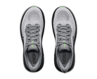 Gray running shoes with black soles on a white background