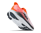 Hoka running shoe with orange and black design on a white background