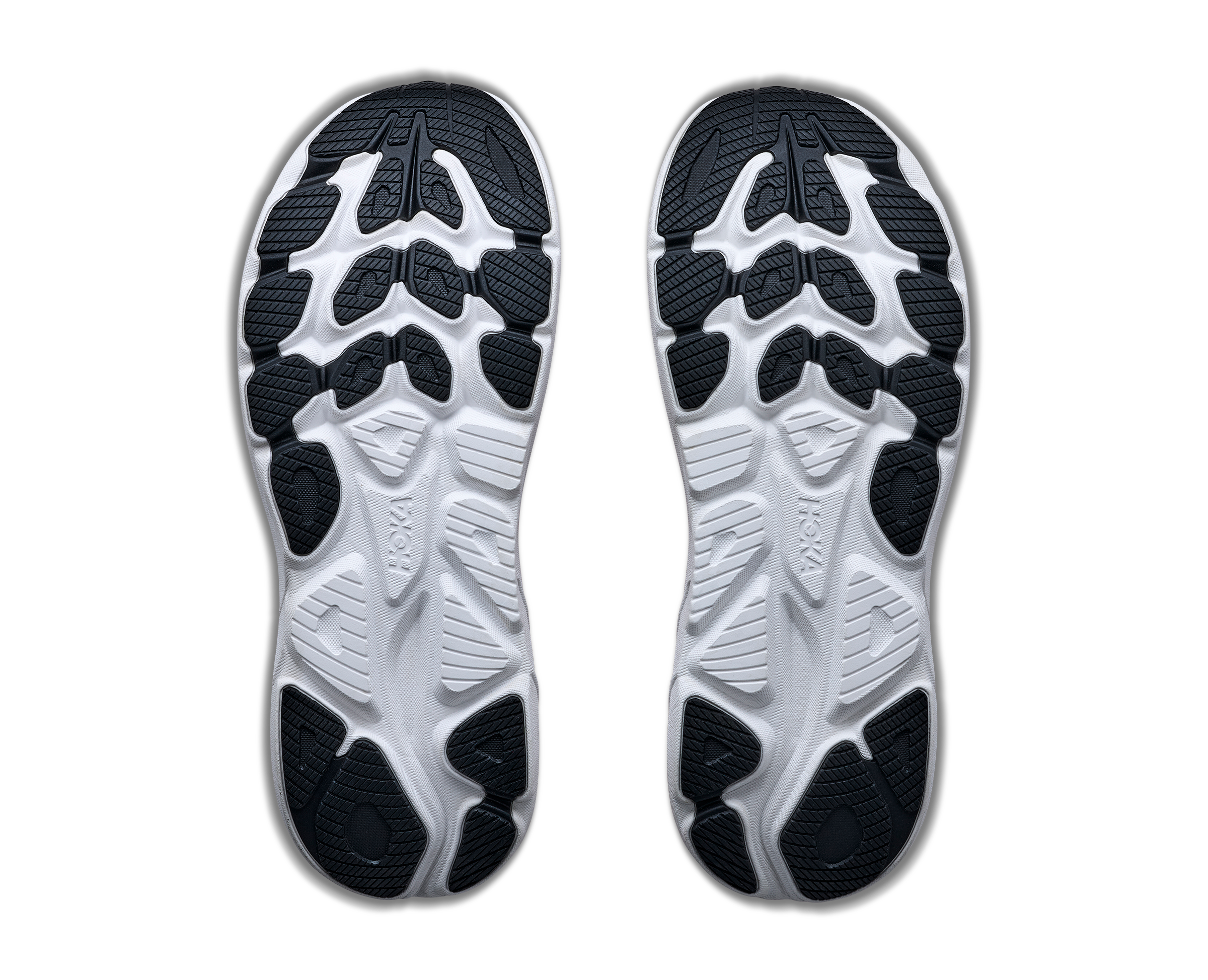 Pair of shoe insoles with a white and black design on a white background