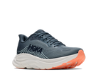 Blue running shoe with orange sole on a white background