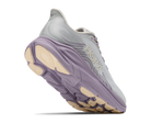 A Hoka running shoe in light gray and lavender purple with beige accents on the midsole and outsole, shown from a three-quarters angle on a white background.