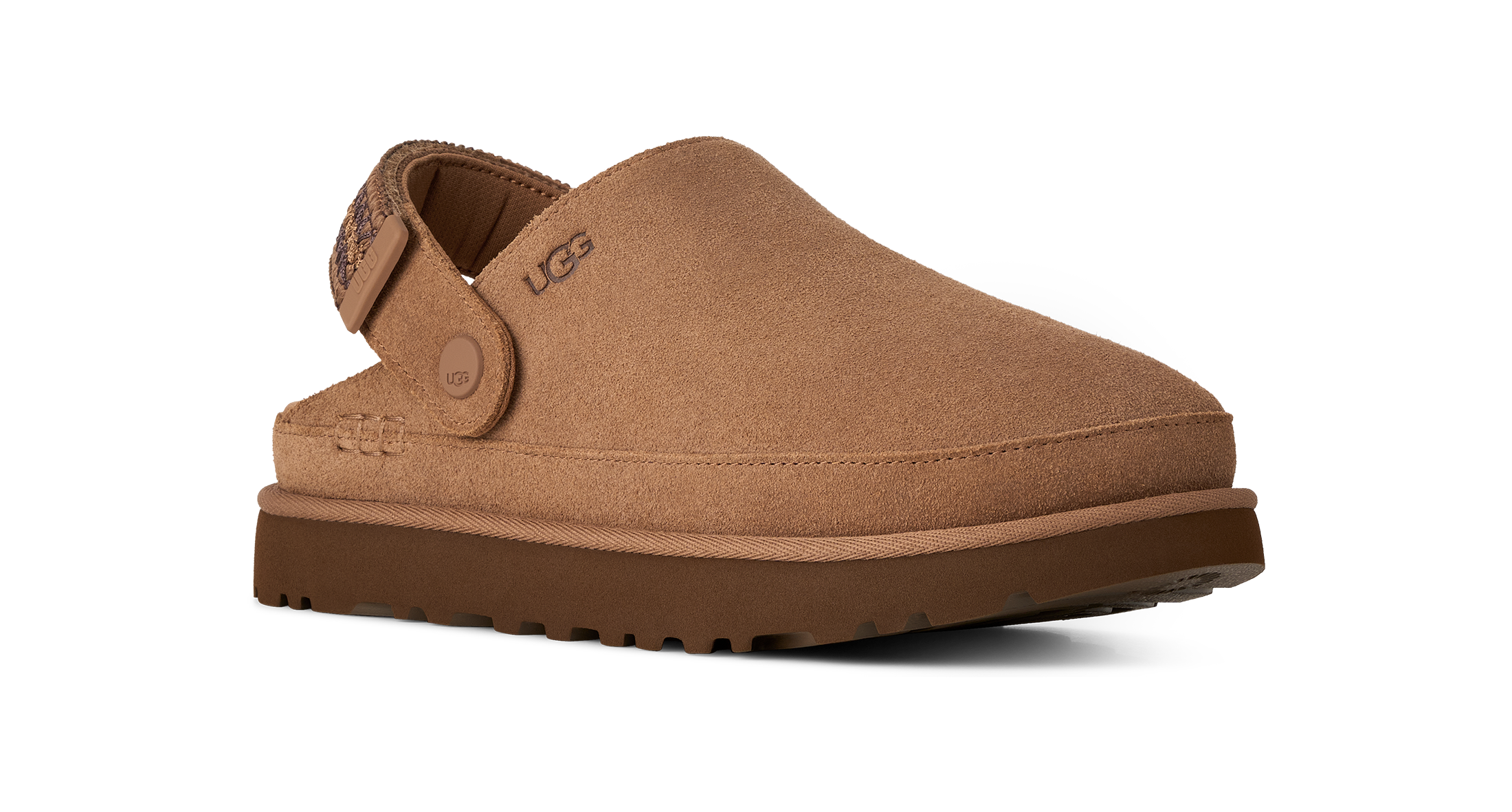 A single UGG slip-on clog shoe in tan suede with a brown sole, shown from a three-quarters angle on a white background.