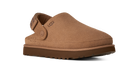 A single UGG slip-on clog shoe in tan suede with a brown sole, shown from a three-quarters angle on a white background.