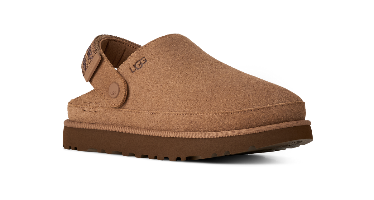 A single UGG slip-on clog shoe in tan suede with a brown sole, shown from a three-quarters angle on a white background.