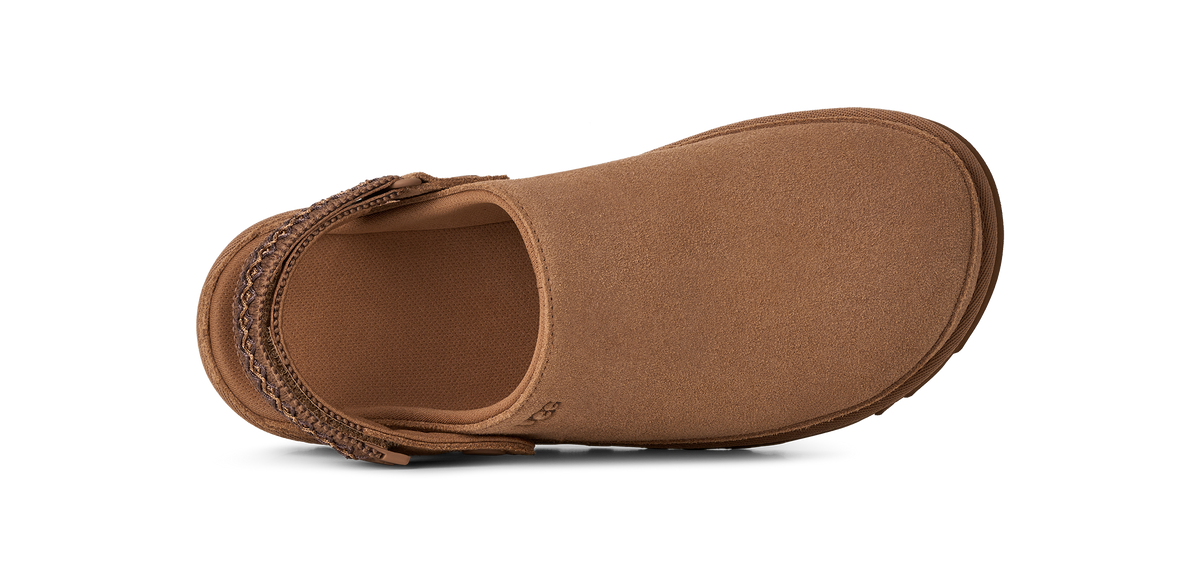 A single brown slip-on shoe shown from a top-down view against a solid white background.