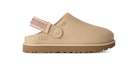 A beige UGG clog shoe with a brown sole and a pink patterned strap, shown from a side profile on a white background.