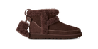 Brown suede boot with fur trim on a white background
