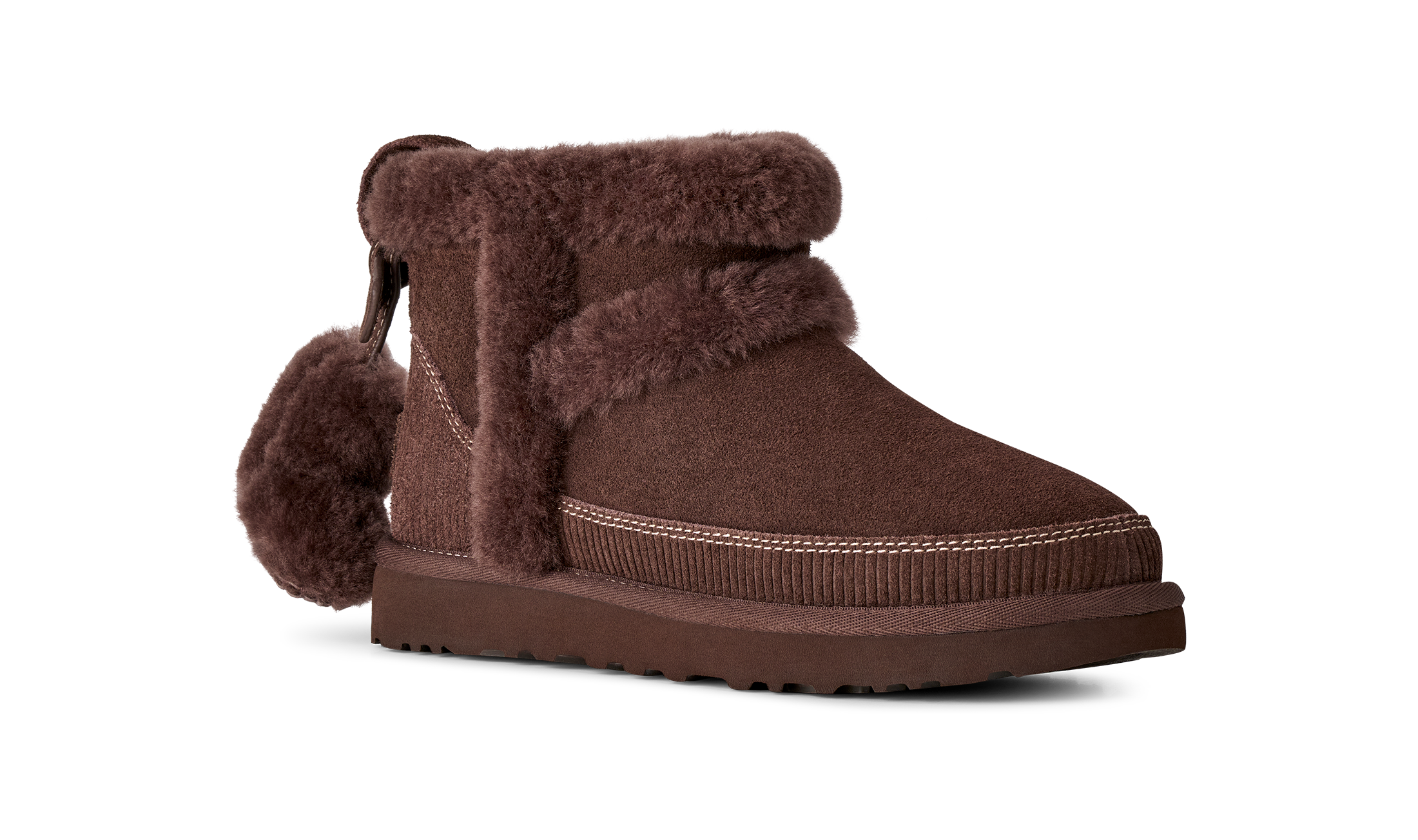 Brown suede boot with fur trim on a white background