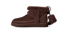 Brown suede boot with fur trim on a white background