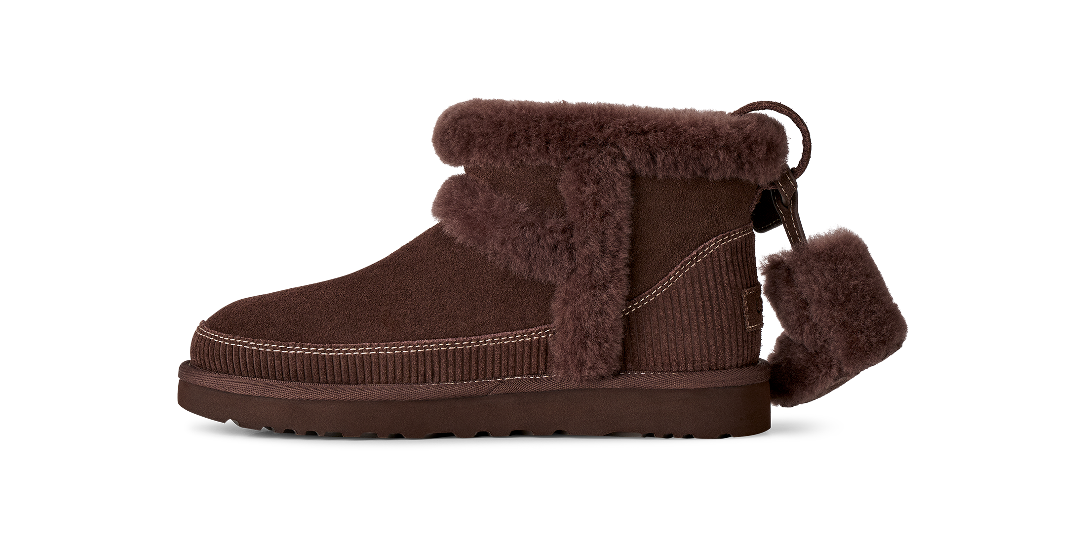 Brown suede boot with fur trim on a white background