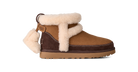 A brown suede and corduroy ankle boot with thick cream shearling lining, a decorative hanging shearling pom-pom, and a brown sole, shown against a plain white background.
