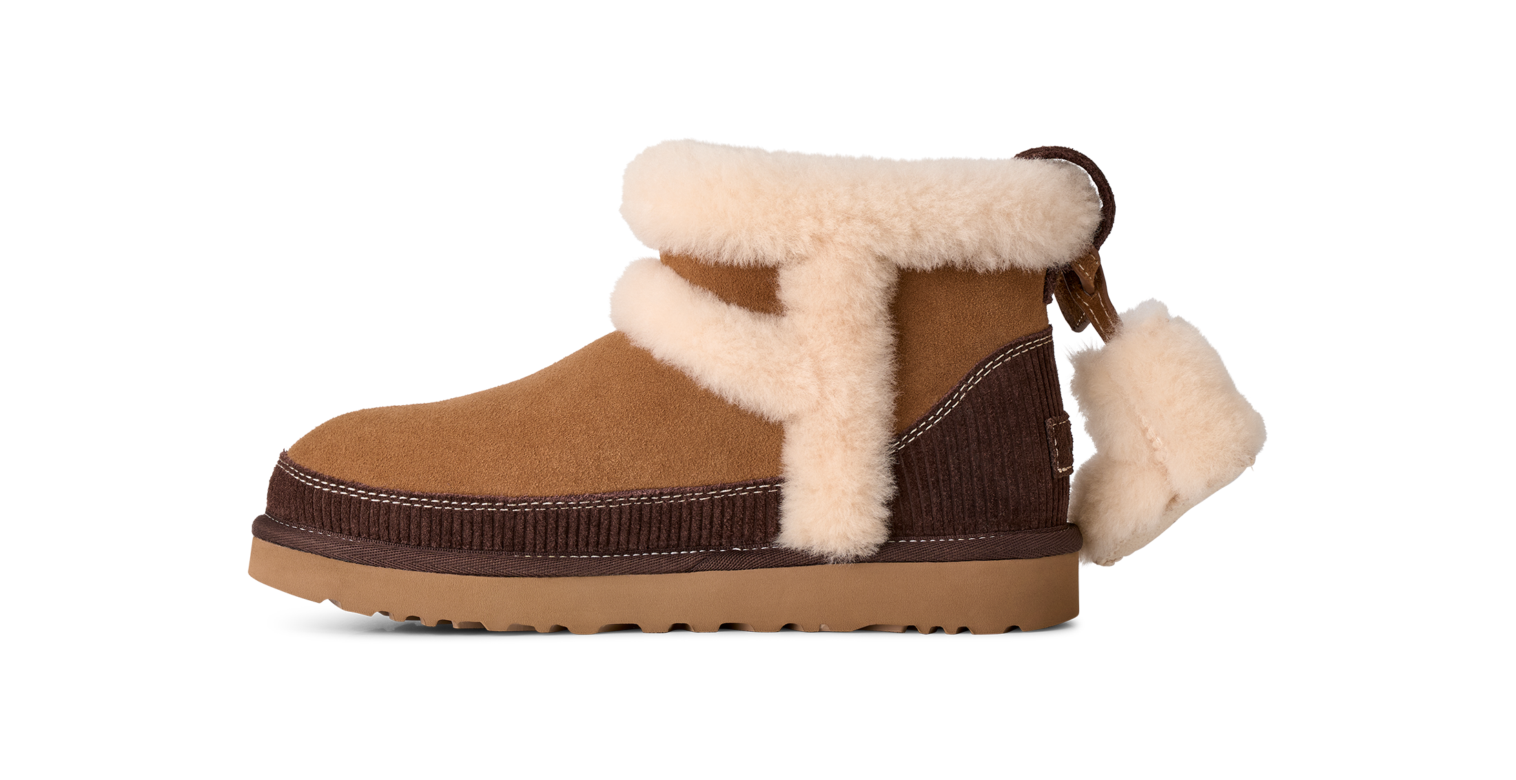 A brown suede and corduroy ankle boot with thick cream shearling lining and a matching pull tab, shown from a side profile on a white background.