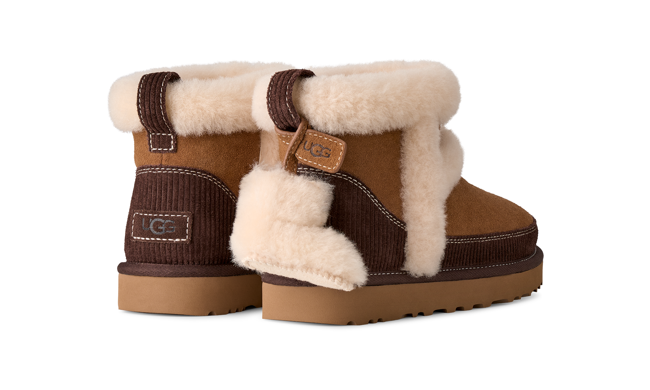 A pair of UGG mini boots featuring a brown suede and corduroy exterior with thick cream shearling lining and a tan sole, shown against a plain white background.