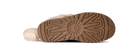 The bottom sole of a shearling boot, showing a brown treaded rubber outsole with a UGG logo embossed in the center, photographed on a white background.