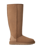 A tall, mid-calf suede boot in a warm camel brown color, shown from a side profile view against a plain white background.