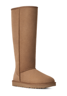 A single tall mid-calf boot in a warm tan-brown suede or shearling-like material, shown in side profile against a plain white background.