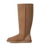 A single mid-calf suede boot in a warm tan-brown color, shown in a side profile against a plain white background.