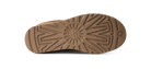 The bottom sole of a brown shoe, showing a detailed tread pattern and a circular logo embossed in the center, isolated on a white background.