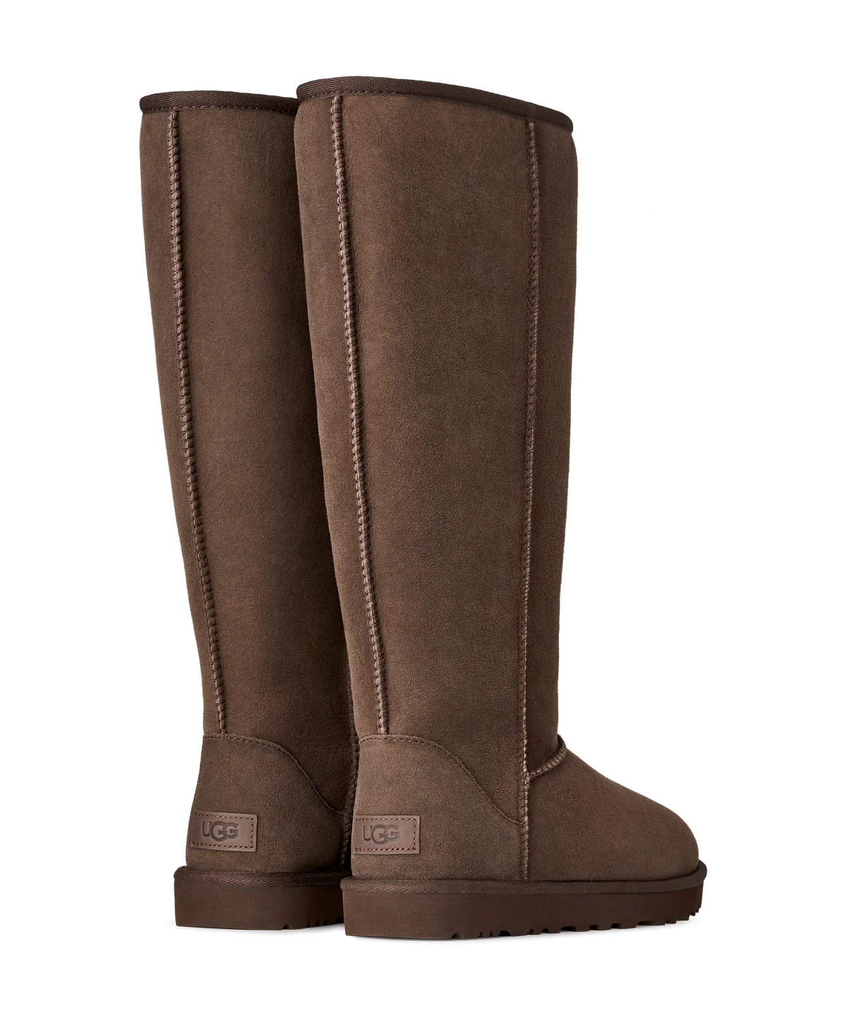 A pair of UGG tall brown suede boots shown from the back three-quarter view against a plain white background.