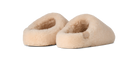 Pair of beige slippers on a white background