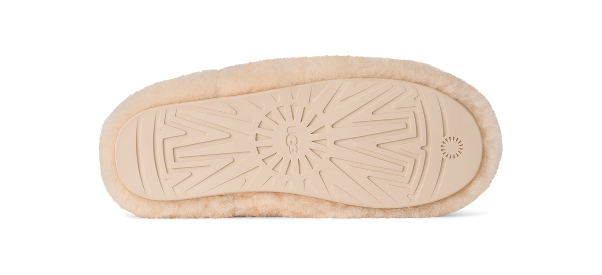 Beige shoe sole with tread pattern on a white background