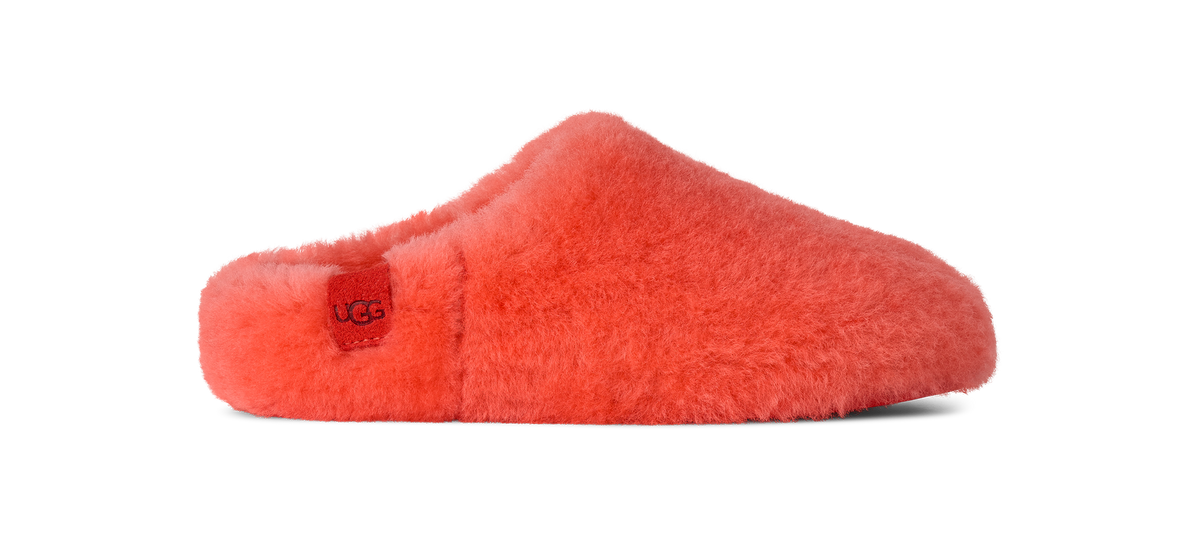 Red fuzzy slipper with UGG logo on a white background