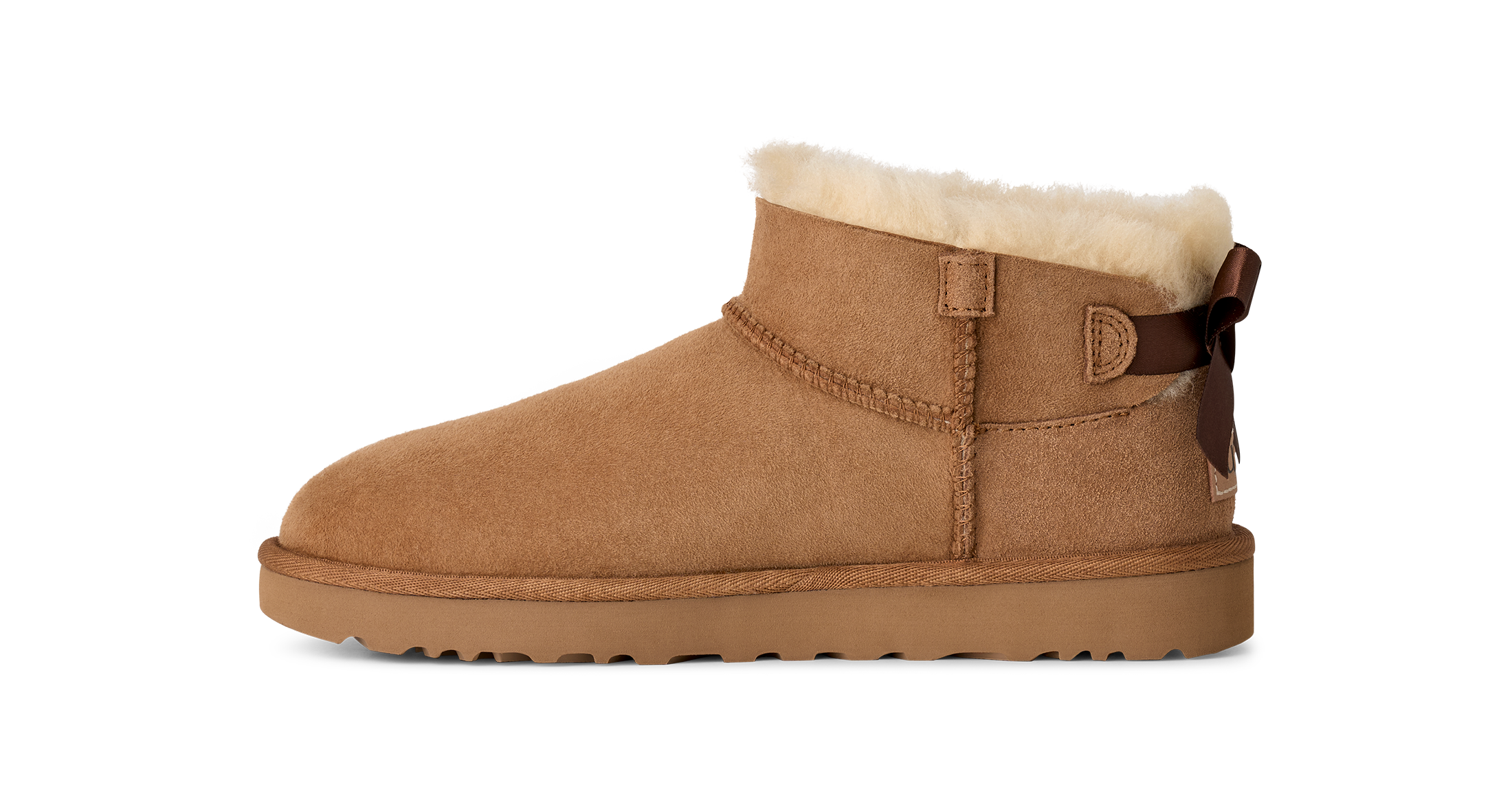 Brown suede boot with white fur lining on a white background
