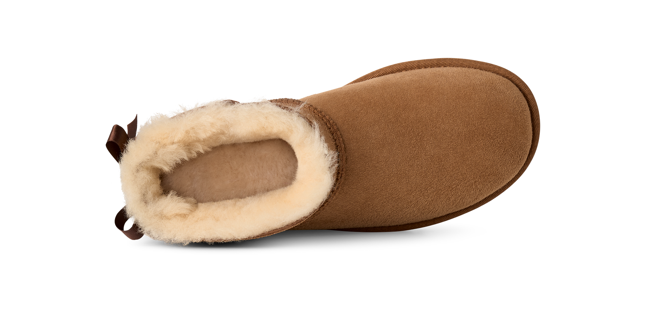 Brown slipper with beige fur lining on a white background