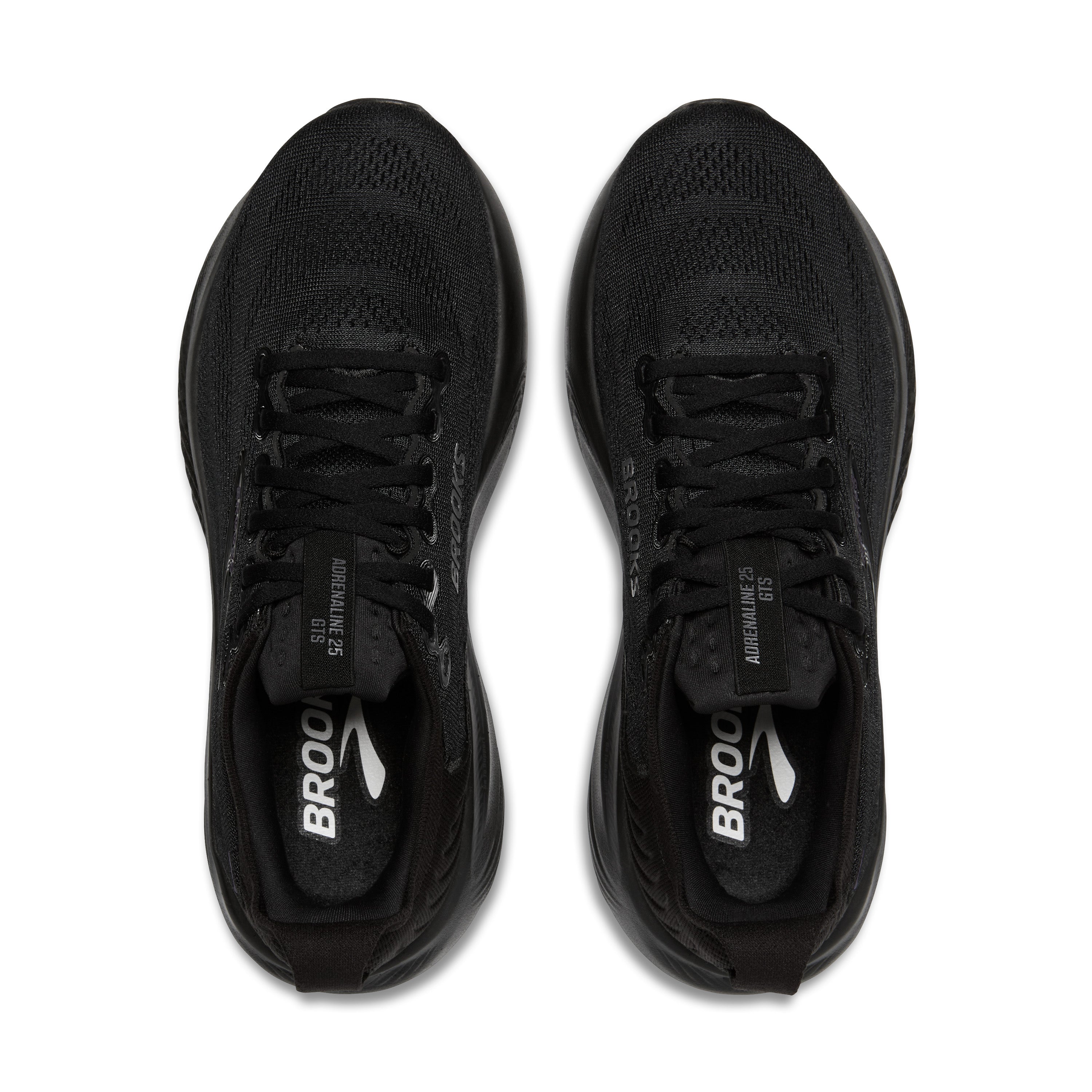 Black running shoes with 'Brooks' branding on a white background