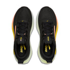 Black running shoes with yellow accents on a white background