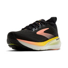 Black running shoe with pink and yellow accents on a white background
