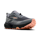 Gray and black running shoe with orange sole on a white background