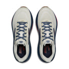White running shoes with blue laces on a white background