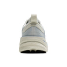 White athletic shoe with a textured sole on a white background