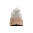 White running shoe with tan sole on a white background