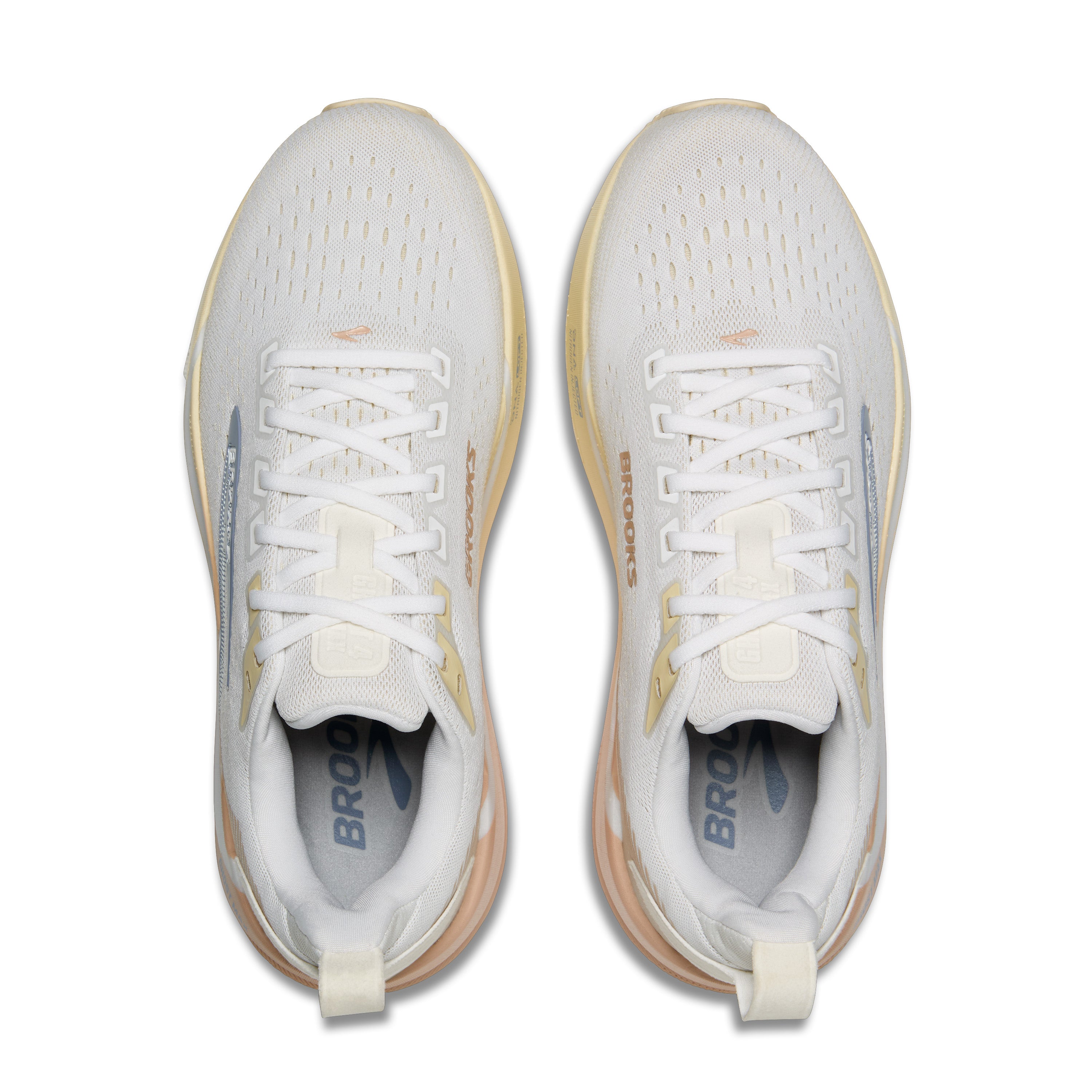 White running shoes with tan soles on a white background