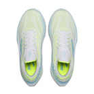 A pair of Brooks running shoes shown from a top-down view, featuring a white mesh upper with a vibrant neon yellow-green gradient, white laces, and a matching neon yellow-green interior lining.