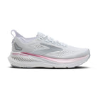 White and gray running shoe with pink sole on a white background