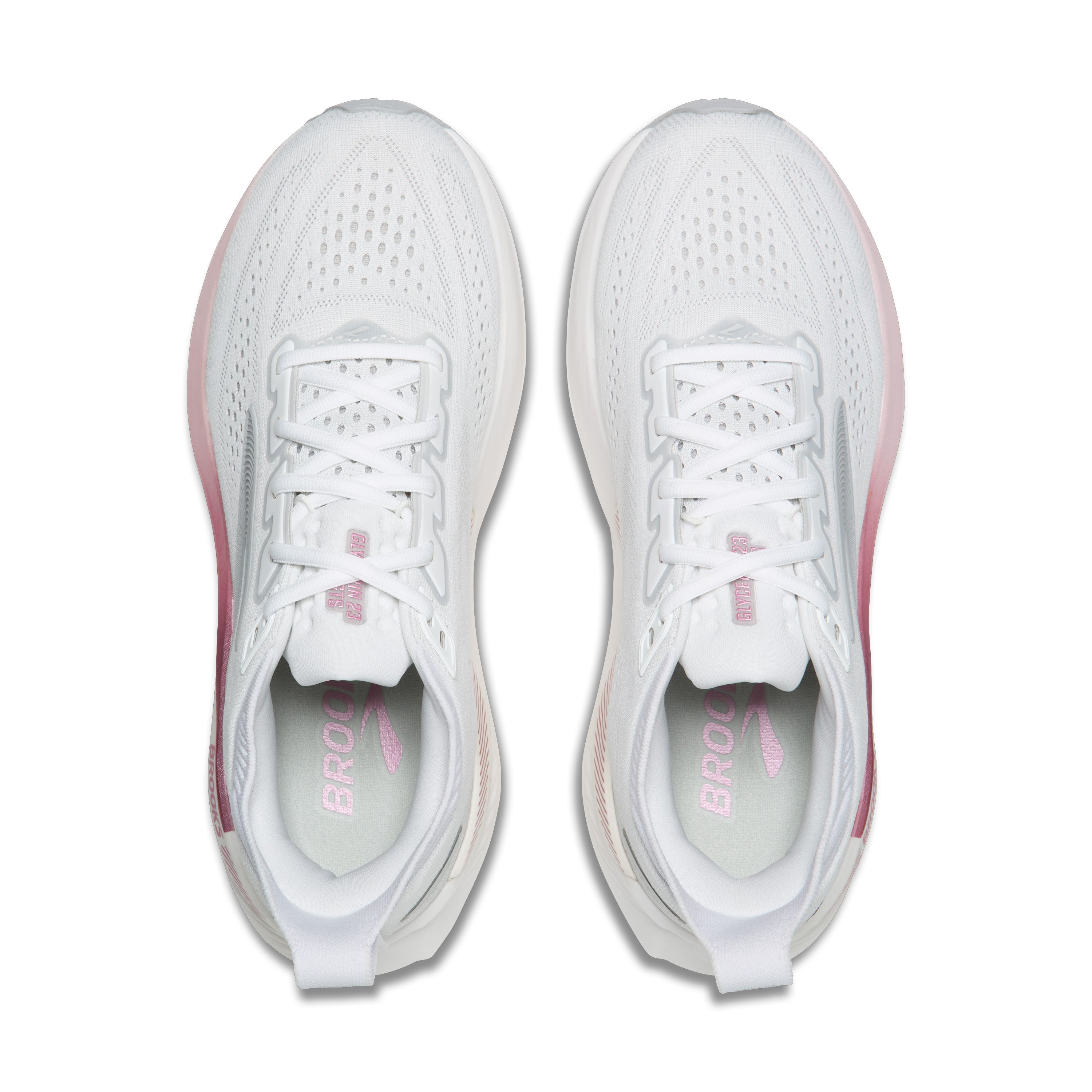 White running shoes with pink accents on a white background