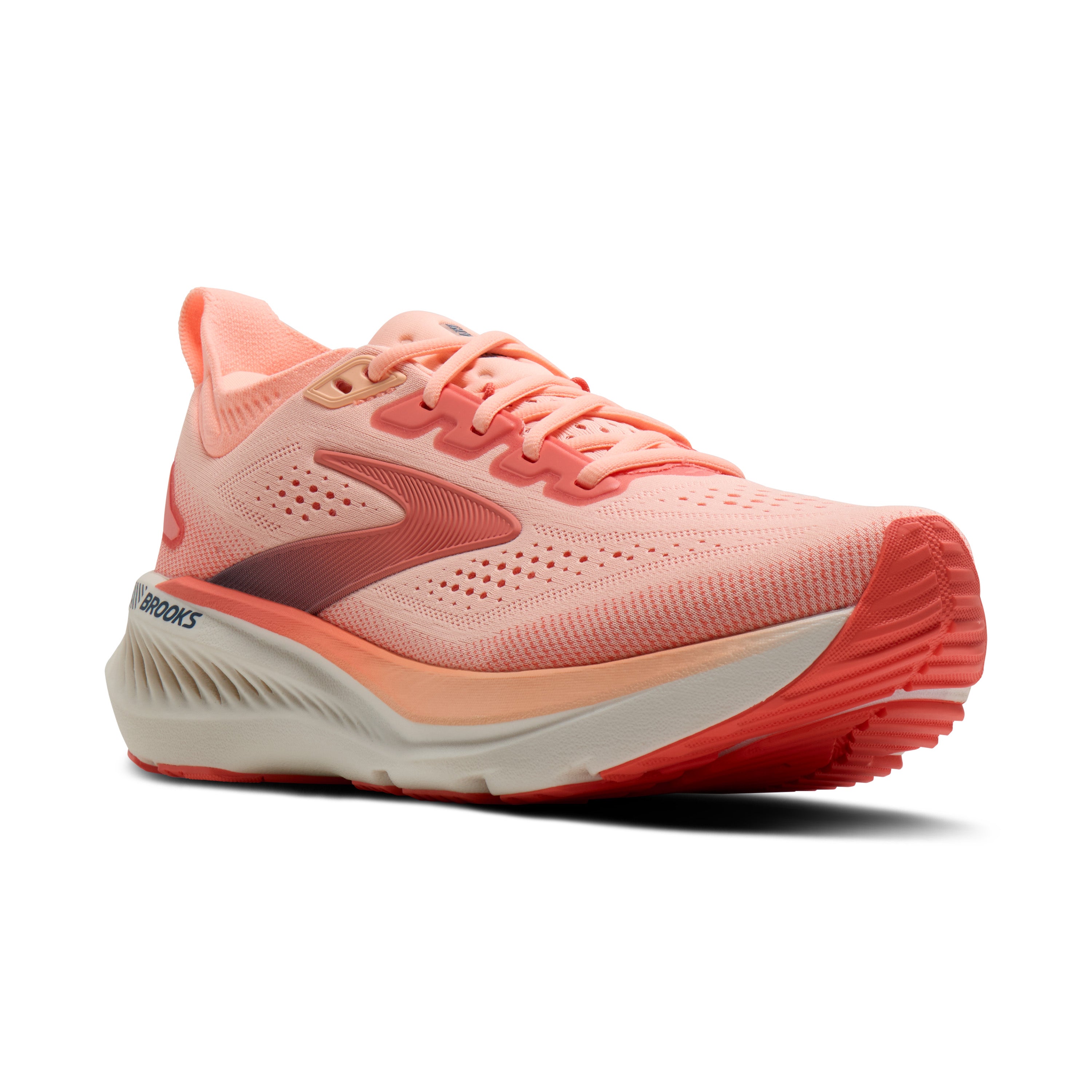 Coral running shoe with white sole on a white background